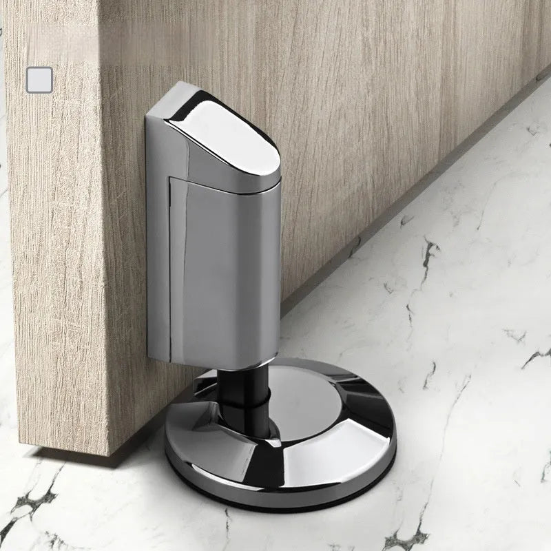A modern invisible door stopper made from zinc alloy in a brushed gold finish.