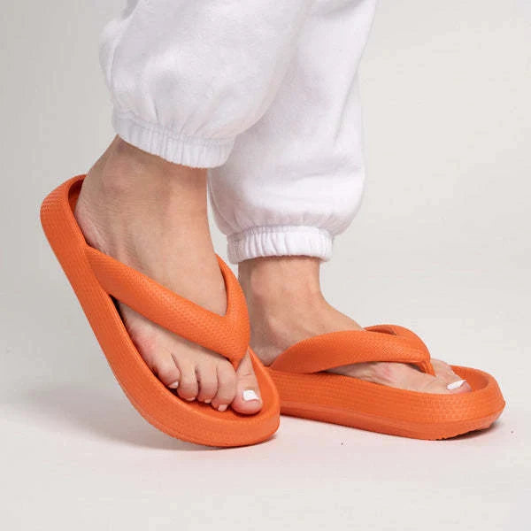 Comfortable beach flip flops with thick EVA sole in various colors for summer wear.