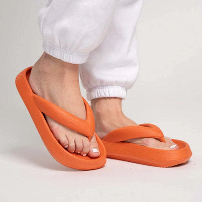 Comfortable beach flip flops with thick EVA sole in various colors for summer wear.