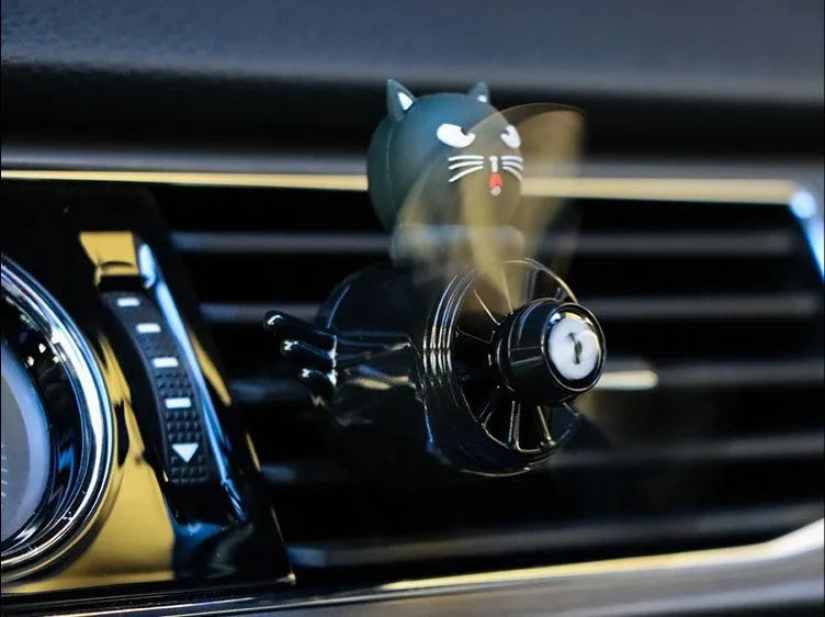 Set of four animal-themed car air vent clip ornaments: black husky, black cat, pink cat, and pink duck.