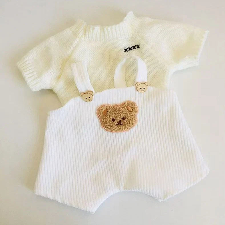 30cm doll clothing collection showing multiple outfit pieces including hooded jackets, sweaters, and suspender pants