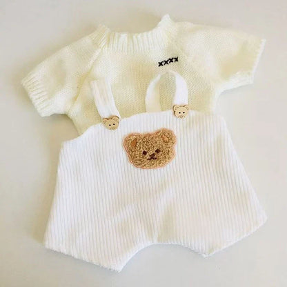 30cm doll clothing collection showing multiple outfit pieces including hooded jackets, sweaters, and suspender pants