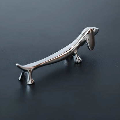 Silver sausage dog chopstick rest and cutlery holder made from zinc alloy with coating for chopsticks, knives or forks