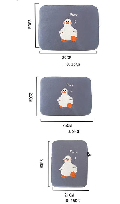 Blue tablet case with embroidered cartoon duck design showing zipper closure and cotton fabric texture