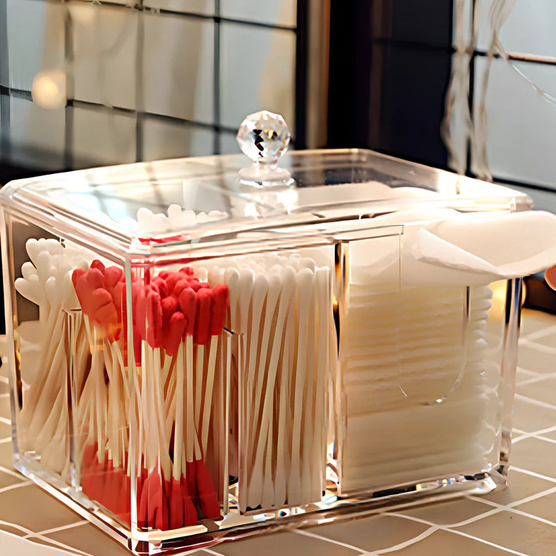 Yajule transparent acrylic cosmetic storage box with cover and compartments organises cotton swabs, lipsticks, and cotton pads on dressing tables while protecting contents from dust