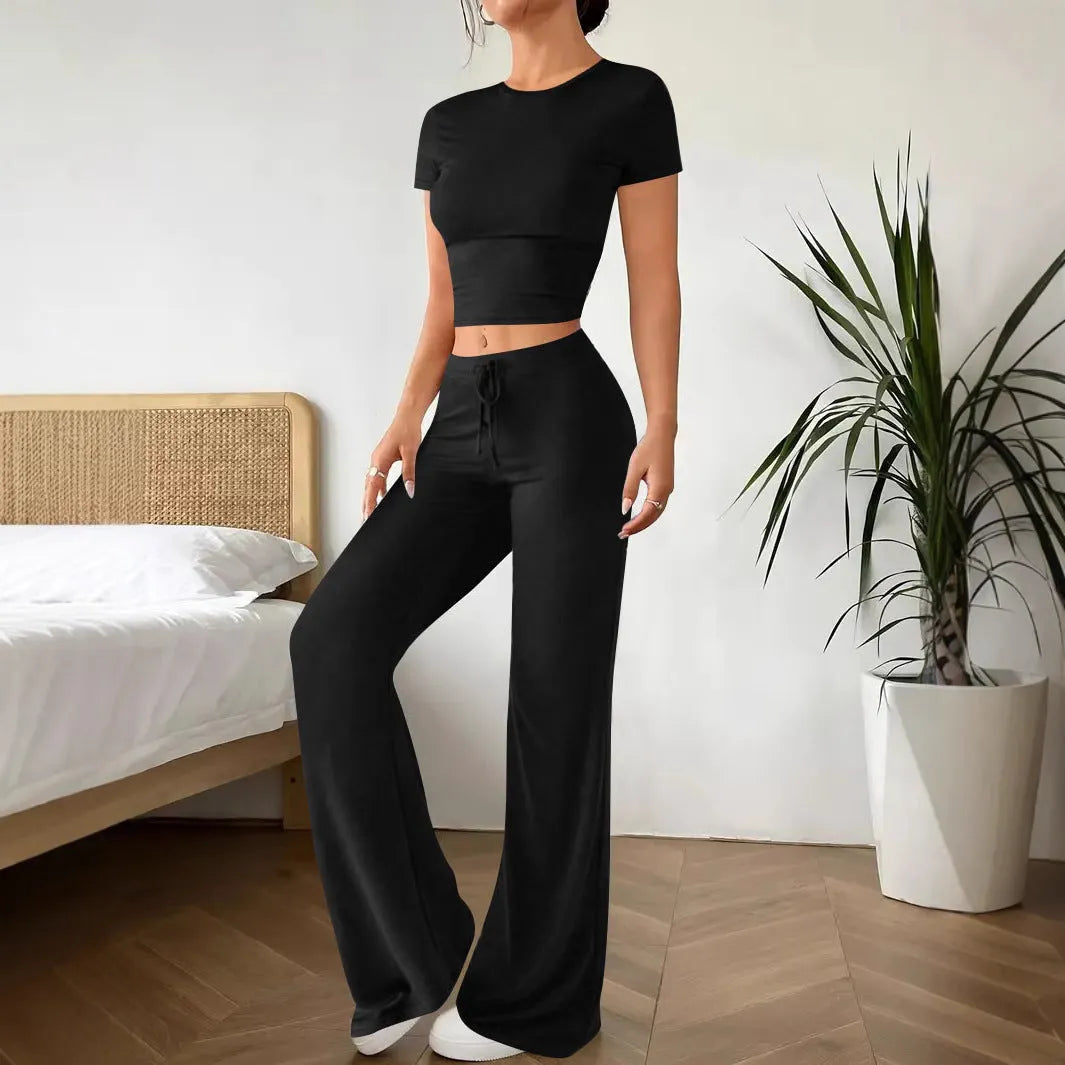Black high waist trousers and regular sleeve t-shirt suit set on a model, showing the coordinated two-piece outfit