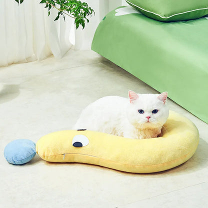 Blue rectangular pet bed cushion pad on a wooden floor.