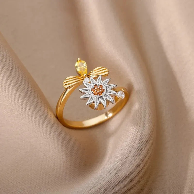Adjustable rotatable decompression ring in gold or platinum electroplated copper