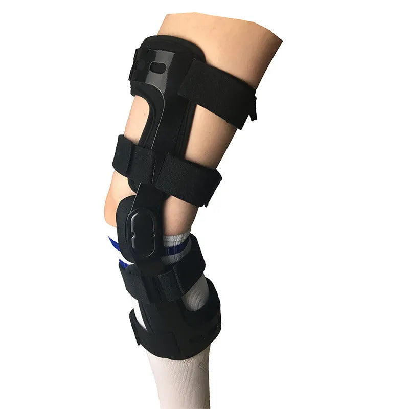 Black anterior ligament knee supporter with adjustable strap, shown on a knee.