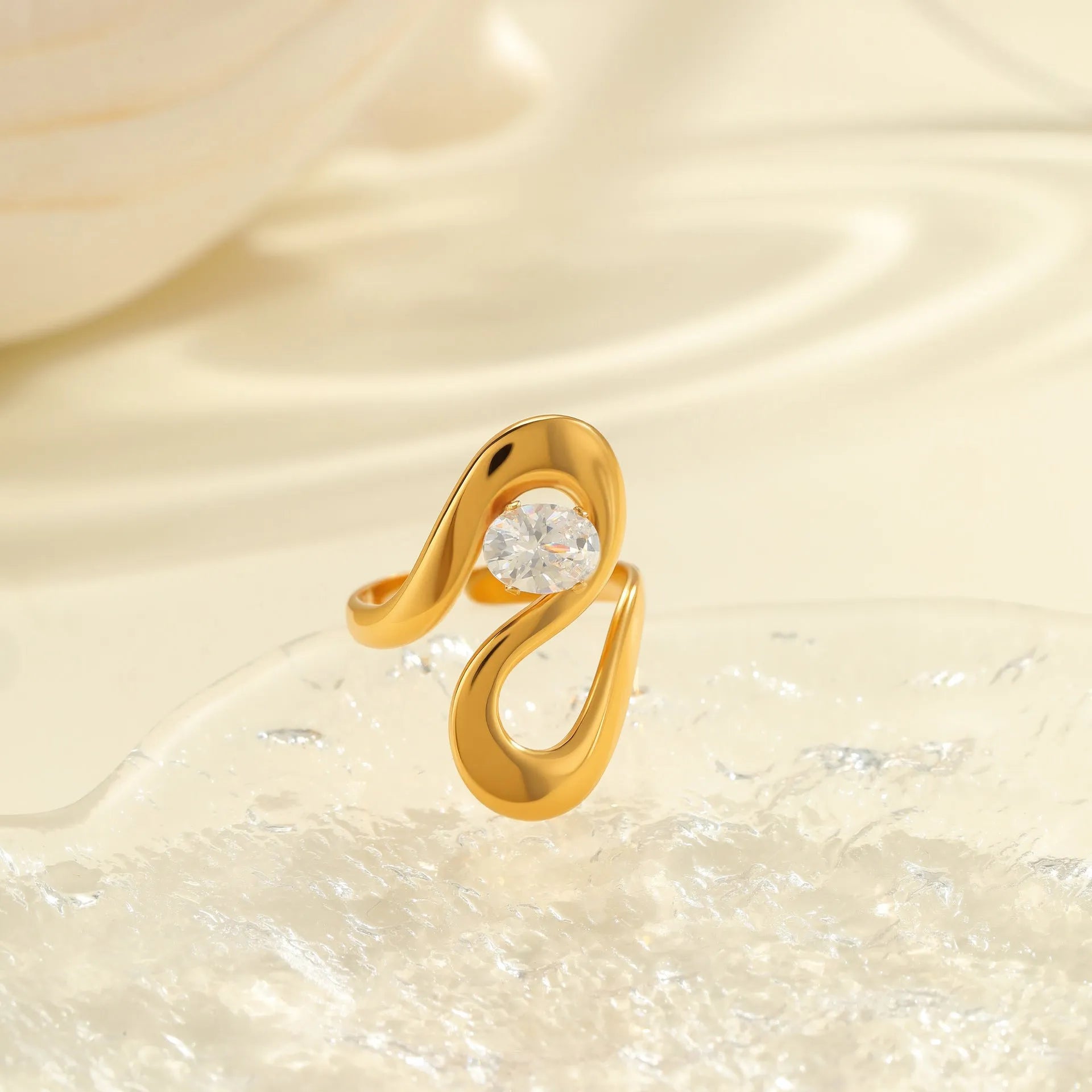 Geometric zircon ring showing round, oval and quadrangular design elements in stainless steel with electroplated finish