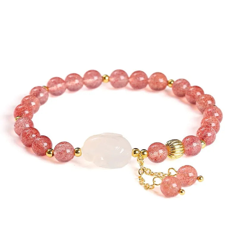 Women's strawberry quartz agate bracelet with 6mm round beads and white rabbit charm.