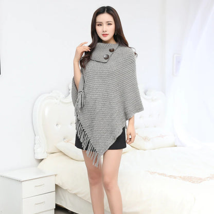 Sleeveless polka dot shawl in apricot colour draped over chair, showing 150cm length and acrylic fibre texture