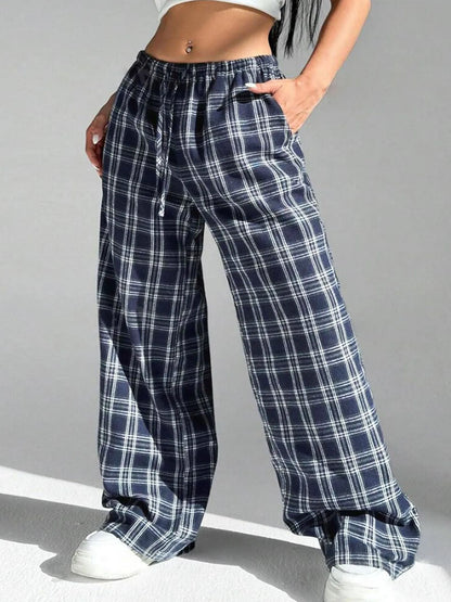 Women's loose plaid trousers with drawstring waist and pockets in red or blue colour options