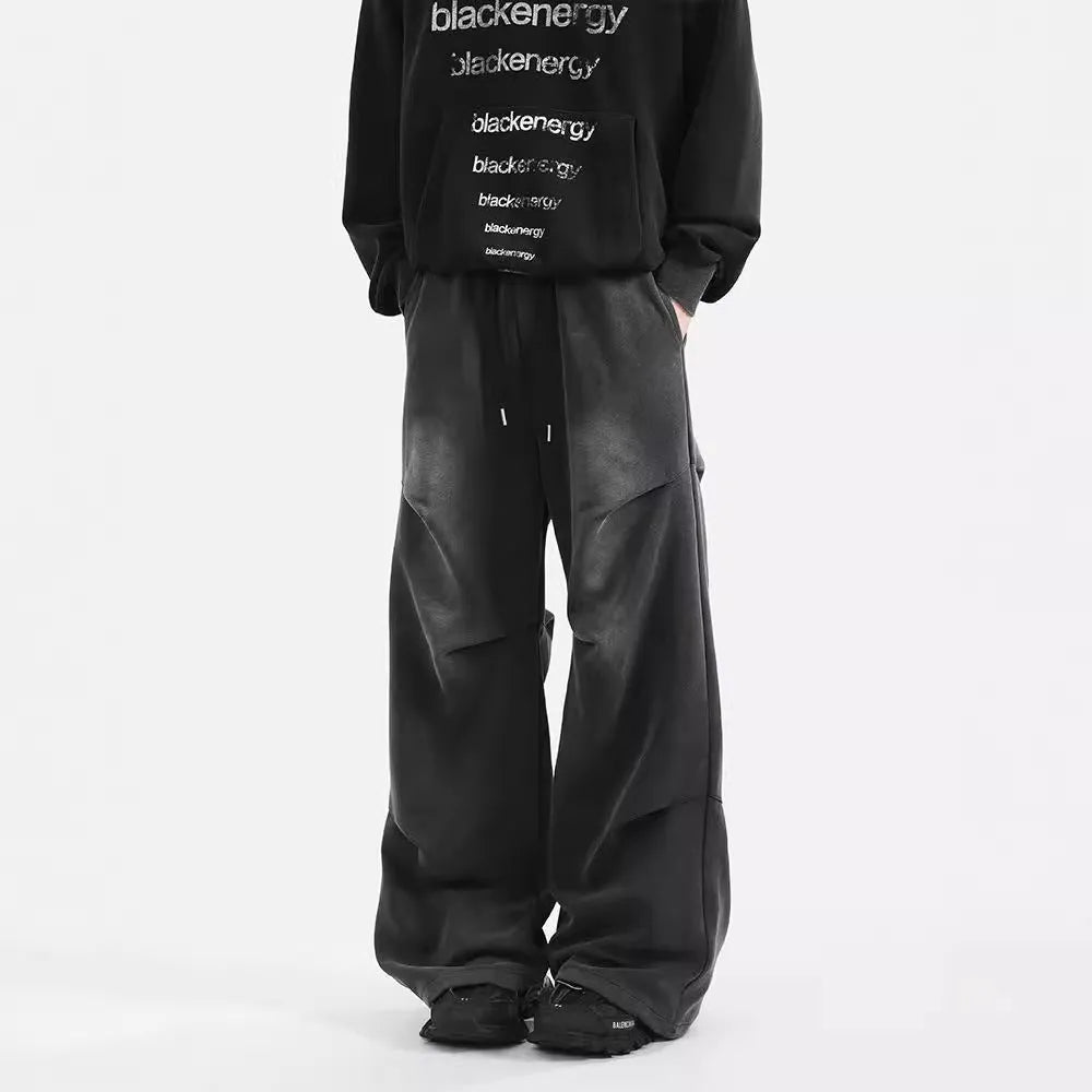 Men's cotton straight-leg sweatpants in black and gray with pleated washed finish and elastic waist