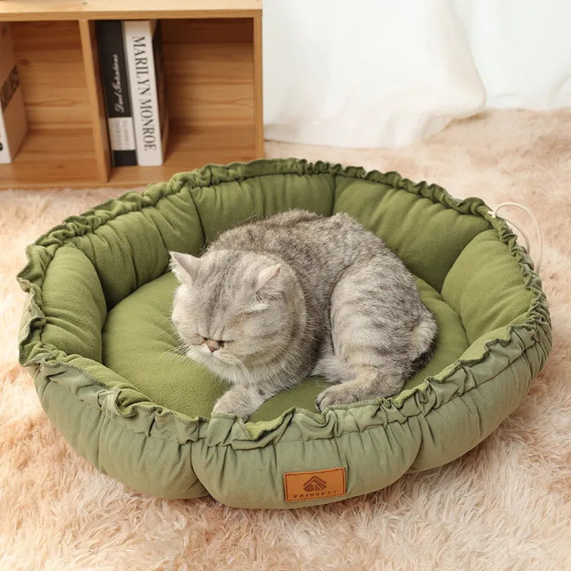 Reversible grey and green donut-shaped pet bed for cats and small dogs