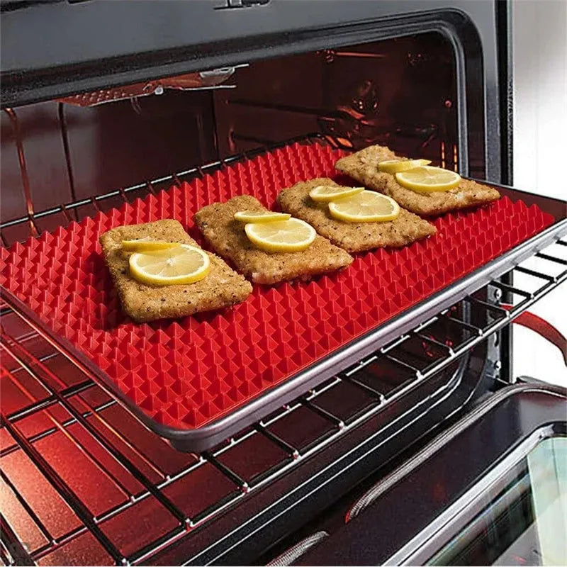 Red silicone pyramid grid cooking mat on a kitchen counter