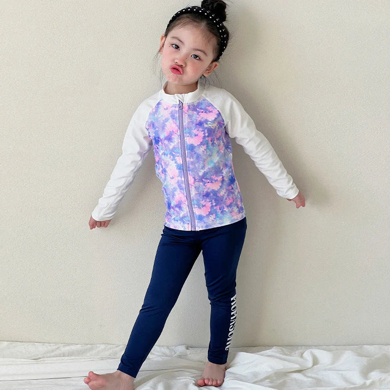 Girls' long sleeve swimsuit with split skirt in gradually varied pink colour, showing complete arm coverage and skirt design