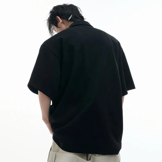 Men's polo shirt with deconstructed collar and geometric pattern in polyester, available in black, gray, and white.