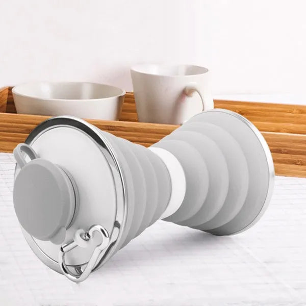 Collapsed and expanded states of a 500ml silicone water bottle with hook and hand rope.
