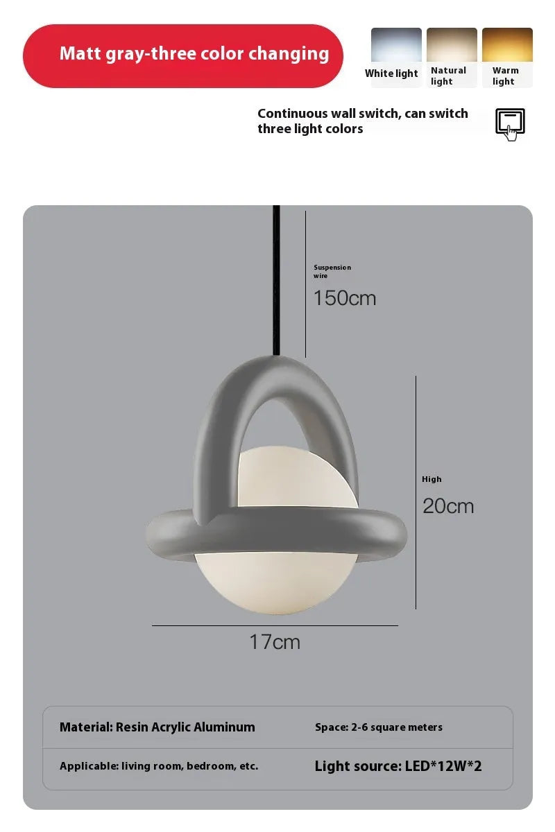 Danish designer hanging line lamp with adjustable cord and matte finish in bedside setting