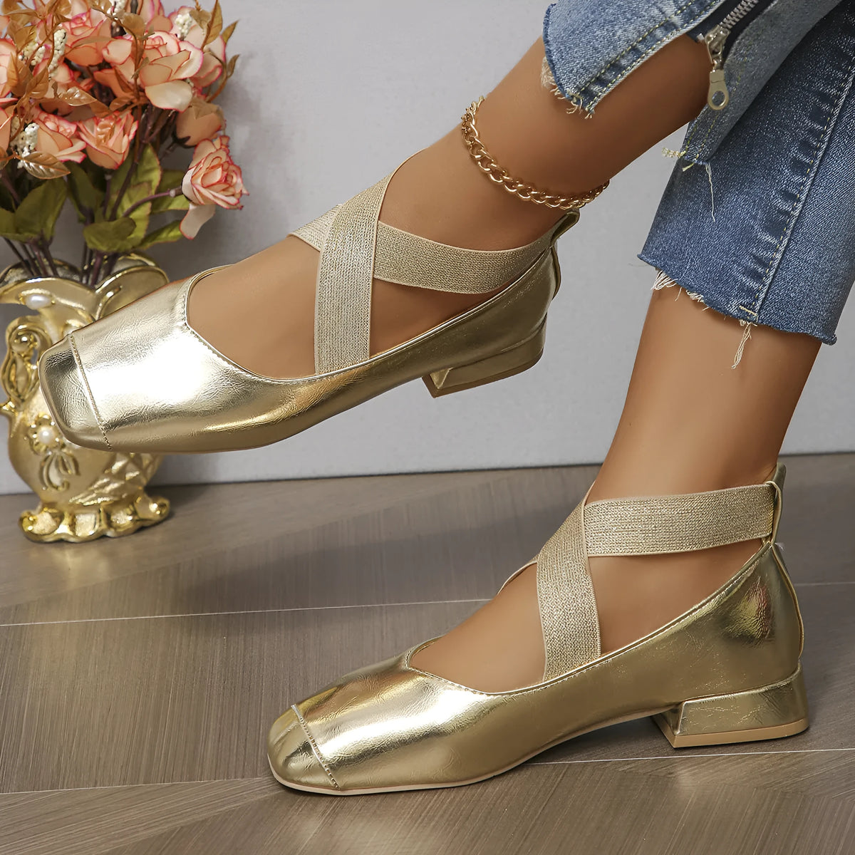 Women's gold slip-on square-toe evening pump with a low rubber heel, shown as a reusable overshoe.