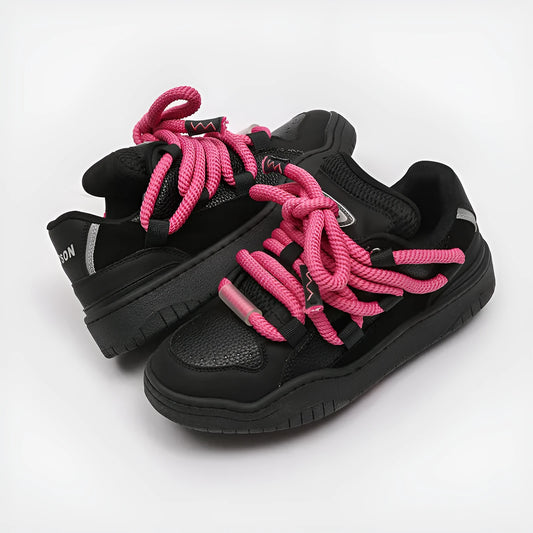 A pair of thick-soled casual lace-up shoes in a solid colour with a round toe and mesh lining.