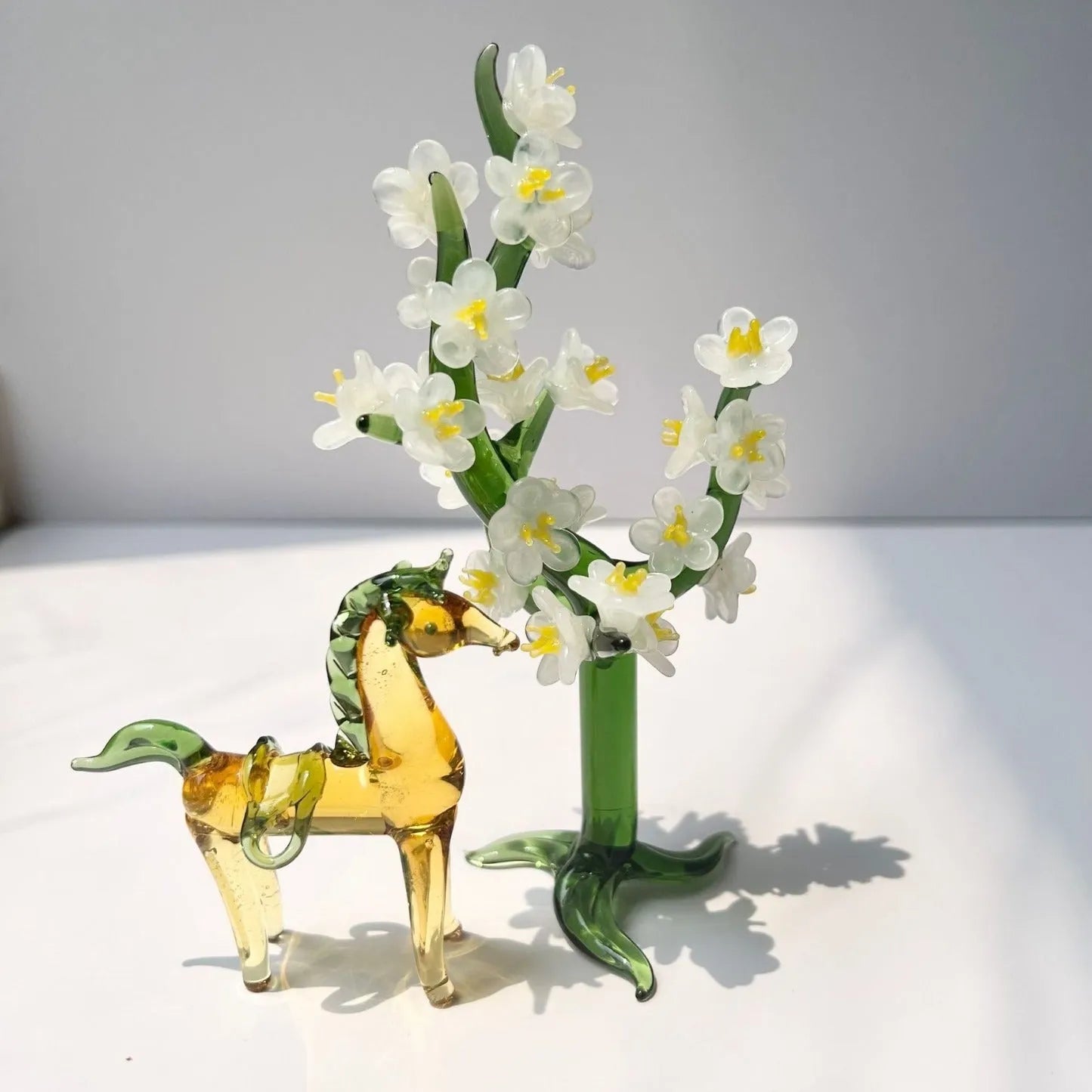 Brown glazed horse decoration on wooden desk with modern minimalist design and glossy finish