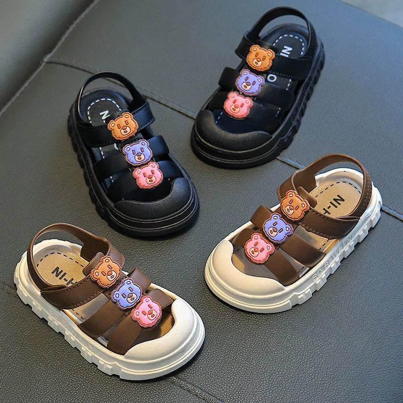 Boy's cartoon pattern baby shoes with non-slip PVC soles and Velcro fastening in black colour