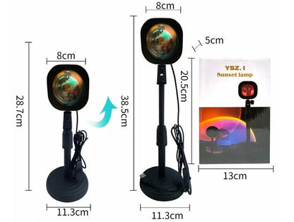 Rechargeable rainbow and sunset projection lamp with USB cable and push-button switch.