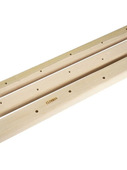Three solid wood hangboards for grip strength training showing different edge depths and lengths
