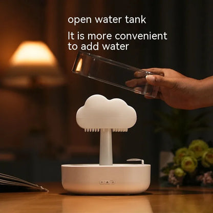 White rain cloud shaped humidifier with LED lighting and water droplet effect