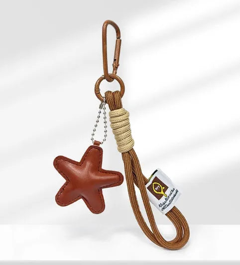 Handmade soda bread handbag pendant with cartoon croissant design on 30cm brown adjustable strap