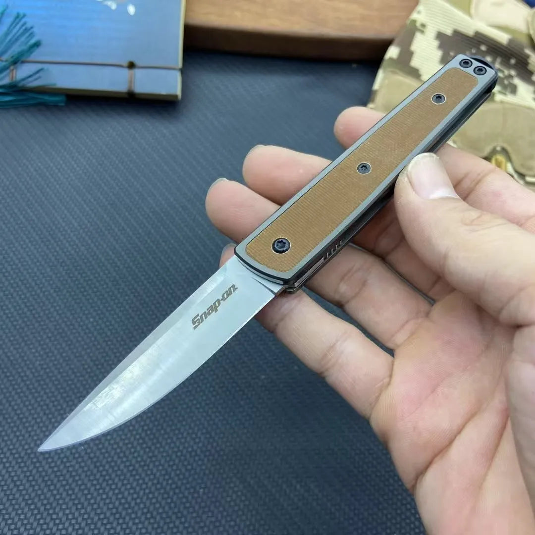 Folding fruit knife with 7cm stainless steel blade shown open and closed, available in black, red, or coffee colour finishes