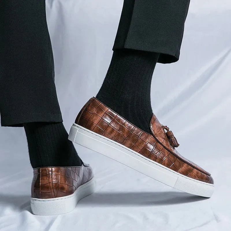 Men's black sneakers with tassel detailing, round toe, and rubber sole for business casual settings