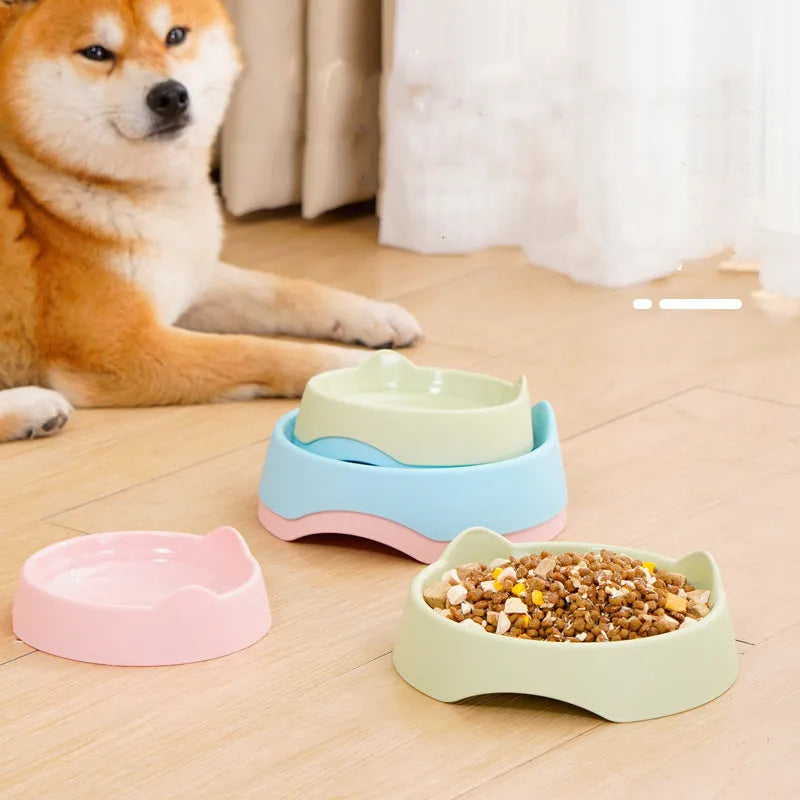 Blue ceramic dog slow feeder bowl with four white cup obstacles inside for puzzle feeding.