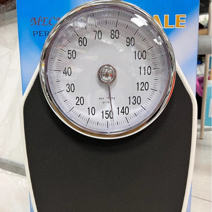 Black mechanical body weight scale with large dial, measuring 47x35x11cm