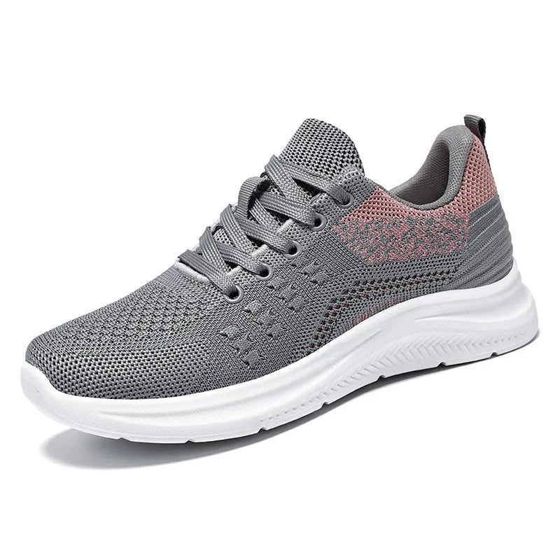 Women's black mesh sneakers with round toe and lace-up design showing breathable construction