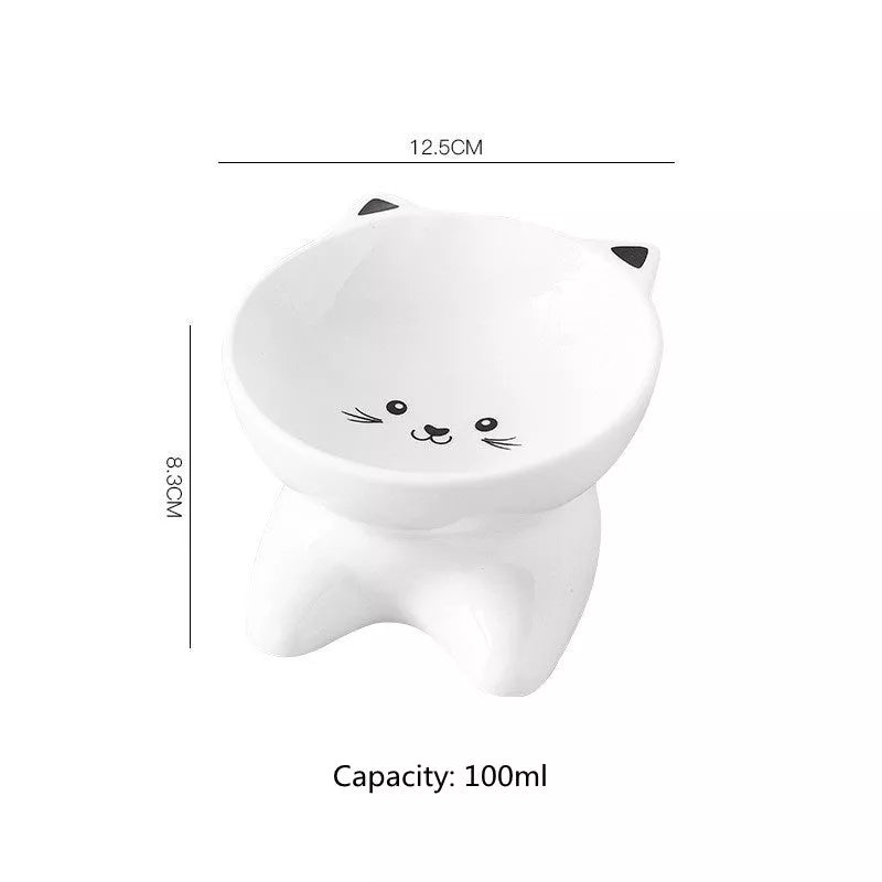 Ceramic pet food bowl with cat face design, easy to clean porcelain material