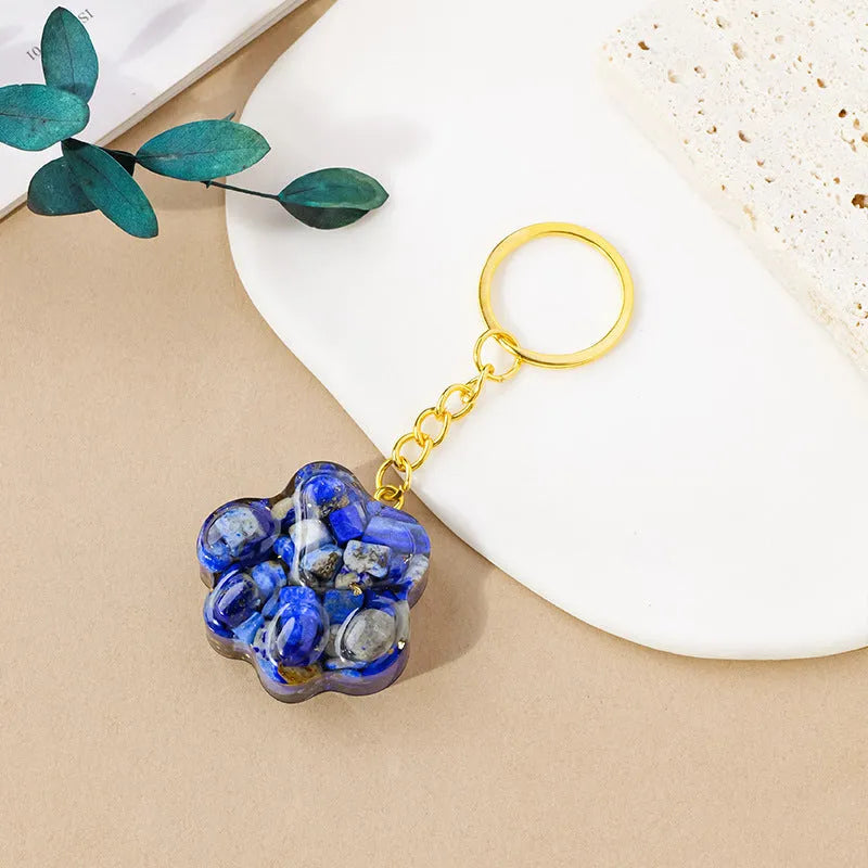 Natural crystal cat's paw keychain pendant showing gemstone options with integrated attachment loop