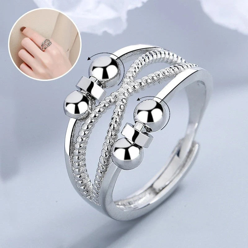 Adjustable rotatable anxiety relief ring for women with open design and platinum finish