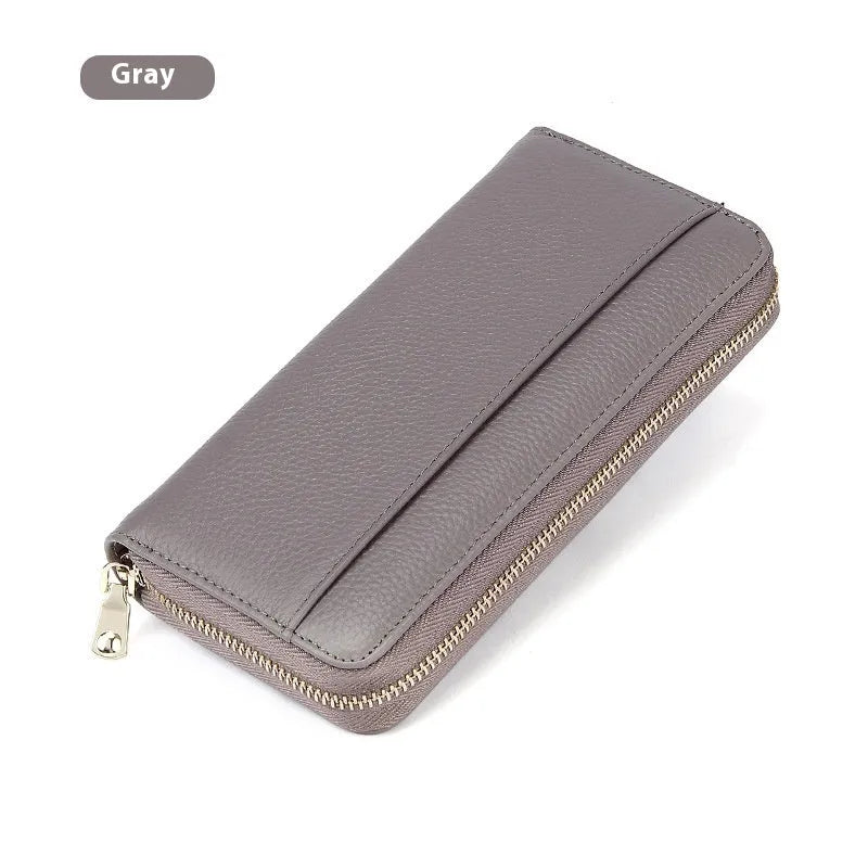 Long genuine leather women's wallet in solid colours with 12 card slots and anti-theft design