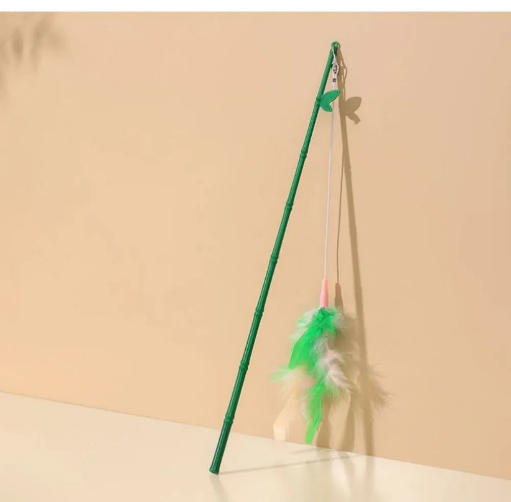 Green interactive cat feather wand toy with bell for durable feline play and stimulation