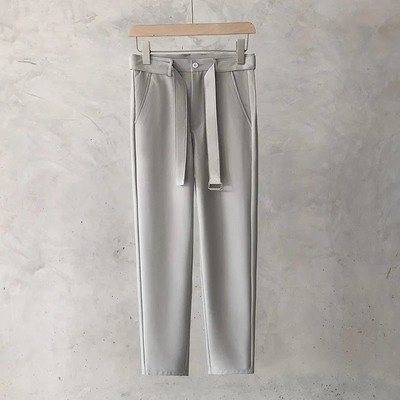 Boys slim straight wool trousers in a tapered fit, shown in a light grey colour.