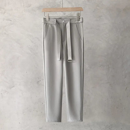 Boys slim straight wool trousers in a tapered fit, shown in a light grey colour.