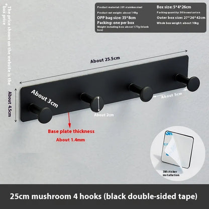 Screwless mushroom-style clothes hook with adhesive backing, shown in white on a tiled wall.