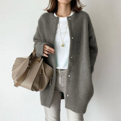 A cozy, knitted cardigan jacket in a variety of colors and sizes, featuring a relaxed open-front silhouette and premium construction for versatile layering.