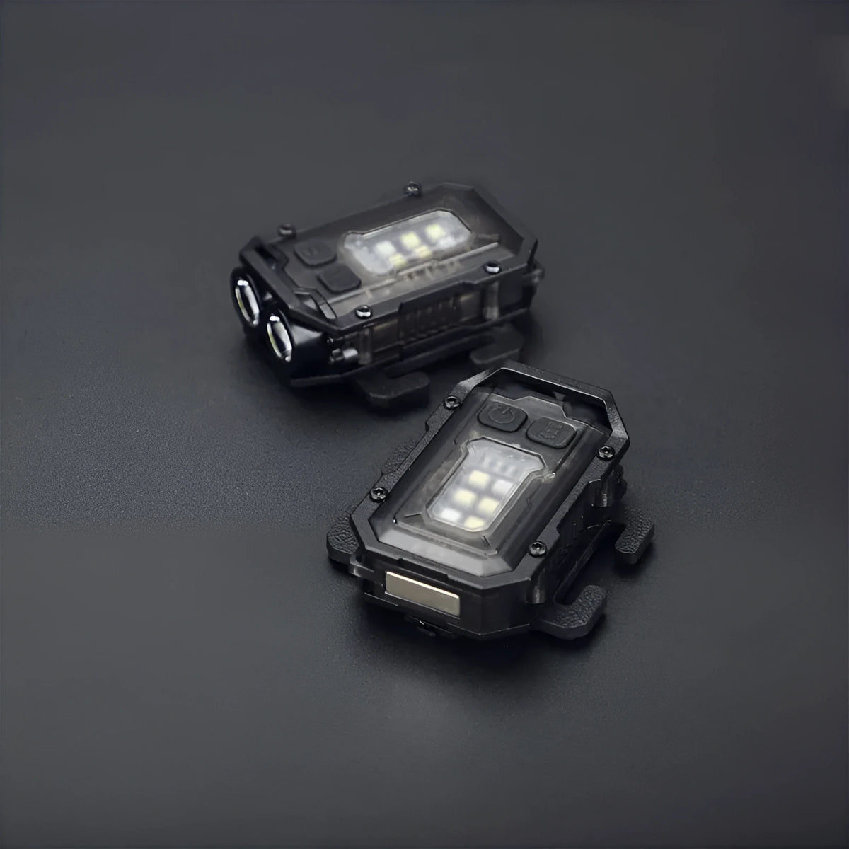 Compact black rechargeable tactical flashlight with USB charging cable for backpack mounting.