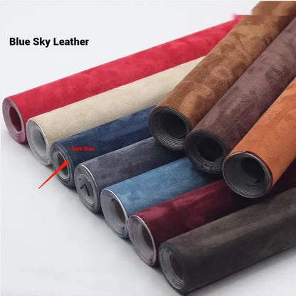 Rolls of self-adhesive leather suede in multiple colours showing texture and adhesive backing.