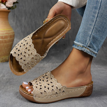 Women's black wedge beach slippers with flower cutout decoration on the PVC upper