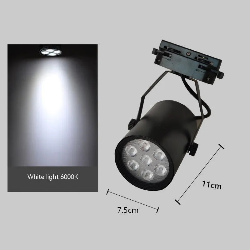 LED track spotlight with aluminium shell in black or white finish, mounted on a lighting track.